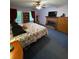 Main bedroom featuring a brick fireplace, ceiling fan, and access to back yard at 3876 Winners Ct, Marietta, GA 30062
