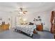 Spacious primary bedroom with carpet, ceiling fan, two dressers, and two entrances at 3876 Winners Ct, Marietta, GA 30062