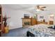 Primary bedroom with a brick fireplace and a view into the attached bathroom at 3876 Winners Ct, Marietta, GA 30062