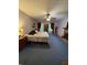 Main bedroom featuring a brick fireplace, ceiling fan, and access to back yard at 3876 Winners Ct, Marietta, GA 30062