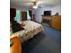 Main bedroom with a brick fireplace, ceiling fan, and large bed at 3876 Winners Ct, Marietta, GA 30062
