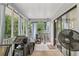 Relaxing screened porch featuring a grill, fan, and serene outdoor views at 3876 Winners Ct, Marietta, GA 30062