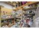 Unfinished storage room with exposed shelves filled with various household items at 3876 Winners Ct, Marietta, GA 30062