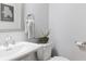 Powder room with white fixtures, decorative mirror, and Atlanta map art at , Atlanta, GA 30316
