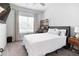 A clean bedroom with large window, ceiling fan, and stylish furnishings and decor at , Atlanta, GA 30316