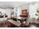 Dining room with wood table, bench seating, and modern light fixture at , Atlanta, GA 30316