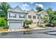 Charming townhome with multiple garages, landscaping, and neutral exterior paint colors at , Atlanta, GA 30316