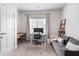 This home office features a large window, desk, shelving, and sitting area at , Atlanta, GA 30316