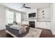 Cozy living room with fireplace, built-in shelves, and modern ceiling fan at , Atlanta, GA 30316