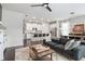 Open-concept living room featuring a ceiling fan and view of the kitchen at , Atlanta, GA 30316