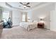 Spacious primary bedroom with tray ceiling and natural light from two windows at , Atlanta, GA 30316