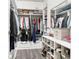 Organized walk-in closet with custom shelving, drawers, and ample hanging space at , Atlanta, GA 30316