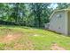Expansive backyard featuring lush greenery and a tranquil wooded backdrop at 270 Hunt Ridge Dr, Stockbridge, GA 30281