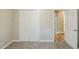 Neutral bedroom featuring a double door closet and view to additional room at 270 Hunt Ridge Dr, Stockbridge, GA 30281