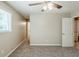 Neutral bedroom featuring a ceiling fan, view to additional room and great natural light at 270 Hunt Ridge Dr, Stockbridge, GA 30281