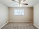 Bright bedroom featuring a ceiling fan, and window offering plenty of natural light at 270 Hunt Ridge Dr, Stockbridge, GA 30281