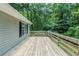 Spacious wooden deck offering serene views of the surrounding lush greenery at 270 Hunt Ridge Dr, Stockbridge, GA 30281