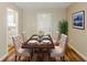 Dining room featuring an elegant table setting and chairs, hardwood floors, and neutral walls at 270 Hunt Ridge Dr, Stockbridge, GA 30281