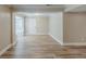Spacious entryway with light wood-look flooring, and entry door with natural light from adjacent room at 270 Hunt Ridge Dr, Stockbridge, GA 30281