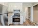 Functional kitchen with white cabinets, stainless steel appliances, and a gas range at 270 Hunt Ridge Dr, Stockbridge, GA 30281