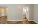 Inviting living area with wood-look floors adjacent to the kitchen, offering a seamless living space at 270 Hunt Ridge Dr, Stockbridge, GA 30281