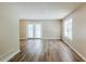 Bright living area featuring wood-look floors, a double glass door to the outside, and a large window at 270 Hunt Ridge Dr, Stockbridge, GA 30281