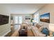 Cozy living room with beige furniture, neutral walls, hardwood floors, and plenty of natural light at 270 Hunt Ridge Dr, Stockbridge, GA 30281