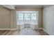 Cozy living room with built-in bench seating under a bay window, and wood-look flooring at 270 Hunt Ridge Dr, Stockbridge, GA 30281