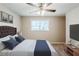 Bedroom with a bed, framed pictures, ceiling fan and a window offering plenty of natural light at 270 Hunt Ridge Dr, Stockbridge, GA 30281