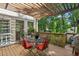 Outdoor deck area with furniture, offering a perfect spot for relaxation and entertaining at 5100 Sunset Maple Trl, Lilburn, GA 30047