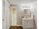 Bathroom with a white vanity, well-lit mirror, and open access to a tiled shower area at 5100 Sunset Maple Trl, Lilburn, GA 30047
