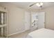 Neutral bedroom showcasing a staircase, ceiling fan, and decorative cabinet at 5100 Sunset Maple Trl, Lilburn, GA 30047