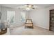 Cozy bedroom with natural light, neutral decor, and comfortable furnishings at 5100 Sunset Maple Trl, Lilburn, GA 30047