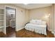 Bedroom with a comfy daybed, decorative pillows, and a cozy reading nook featuring warm lighting at 5100 Sunset Maple Trl, Lilburn, GA 30047