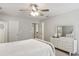 Spacious bedroom featuring a ceiling fan, closet, and bright neutral colors at 5100 Sunset Maple Trl, Lilburn, GA 30047