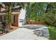 Spacious driveway leading to a two-car garage, complemented by a well-maintained lawn and privacy fencing at 5100 Sunset Maple Trl, Lilburn, GA 30047
