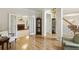 Elegant space with beautiful hardwood floors, with a great view of the staircase and rooms through open french doors at 5100 Sunset Maple Trl, Lilburn, GA 30047