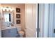 Well-lit bathroom featuring vanity, neutral walls, and tile flooring at 6165 Namon Wallace Dr, Cumming, GA 30028