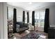 Cozy Bedroom featuring a crib, stylish decor, and plenty of natural light at 6165 Namon Wallace Dr, Cumming, GA 30028