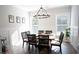 Elegant dining room with lots of natural light, stylish furniture, and modern decor at 6165 Namon Wallace Dr, Cumming, GA 30028