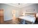 Serene main bedroom with a view into the on-suite bath at 6165 Namon Wallace Dr, Cumming, GA 30028