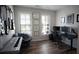 Stylish office with wood floors, a dark desk, and modern decor at 6165 Namon Wallace Dr, Cumming, GA 30028