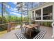 Inviting back deck with outdoor seating, screened porch, and scenic lake views at 1141 Ragley Hall Ne Rd, Brookhaven, GA 30319