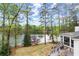 Aerial backyard view featuring a deck and lake access at 1141 Ragley Hall Ne Rd, Brookhaven, GA 30319
