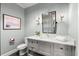 Modern bathroom featuring a gray vanity, stylish lighting, and tile flooring at 1141 Ragley Hall Ne Rd, Brookhaven, GA 30319