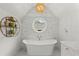 Bright bathroom featuring a freestanding tub with a marble tile backdrop at 1141 Ragley Hall Ne Rd, Brookhaven, GA 30319