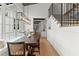 Bright dining area features large windows and hardwood floors. Stairs visible to the right at 1141 Ragley Hall Ne Rd, Brookhaven, GA 30319