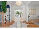 Elegant foyer with hardwood floors, a round table, and a view into the living spaces at 1141 Ragley Hall Ne Rd, Brookhaven, GA 30319
