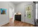 Entry hall with built-in storage cabinets and beautiful front door with glass panes at 1141 Ragley Hall Ne Rd, Brookhaven, GA 30319