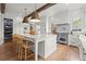 Spacious eat-in kitchen with wooden beams, a large island, and modern appliances at 1141 Ragley Hall Ne Rd, Brookhaven, GA 30319
